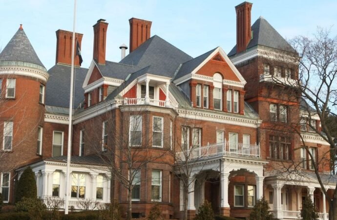 Grand staircases, state-shaped pools, and bowling alleys: Photos show every state governor’s mansion