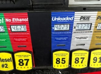 Inflation cooled slightly last month even as consumers stepped up spending