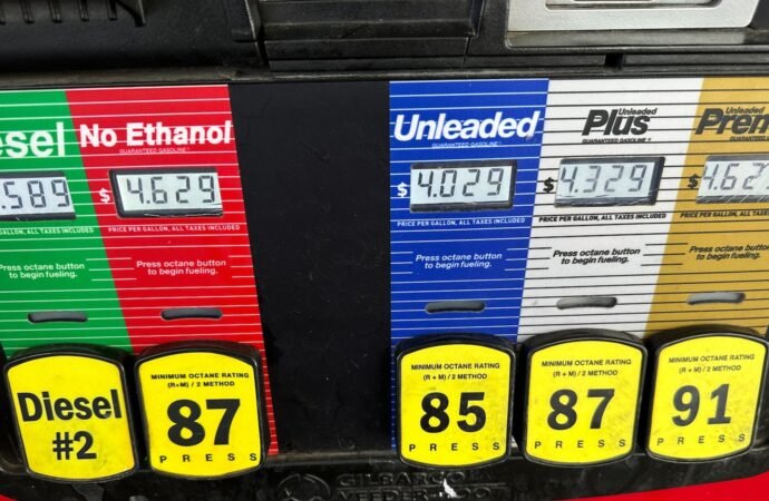 Inflation cooled slightly last month even as consumers stepped up spending
