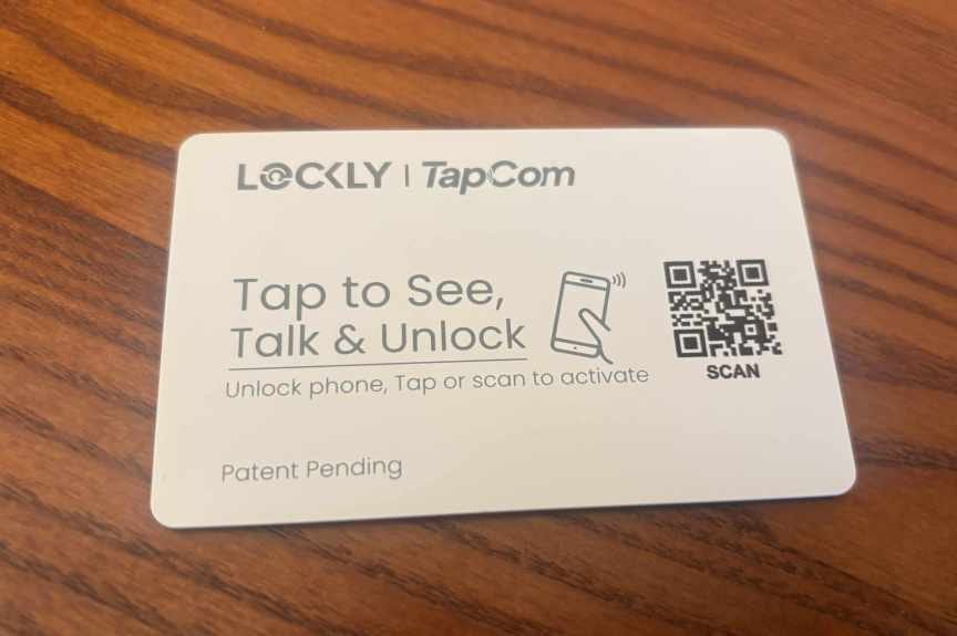 Lockly TapCom card plate on a wood table.