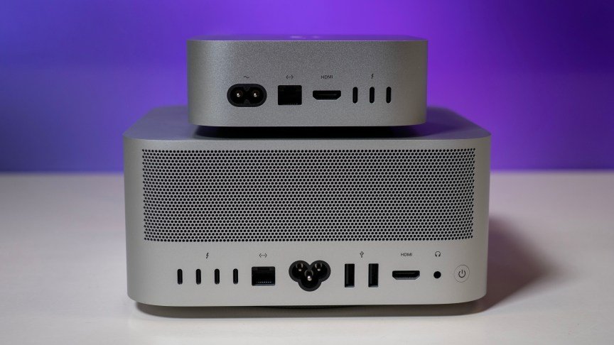 a mac mini on top of a mac studio from behind, showing all of the rear ports and connection options.