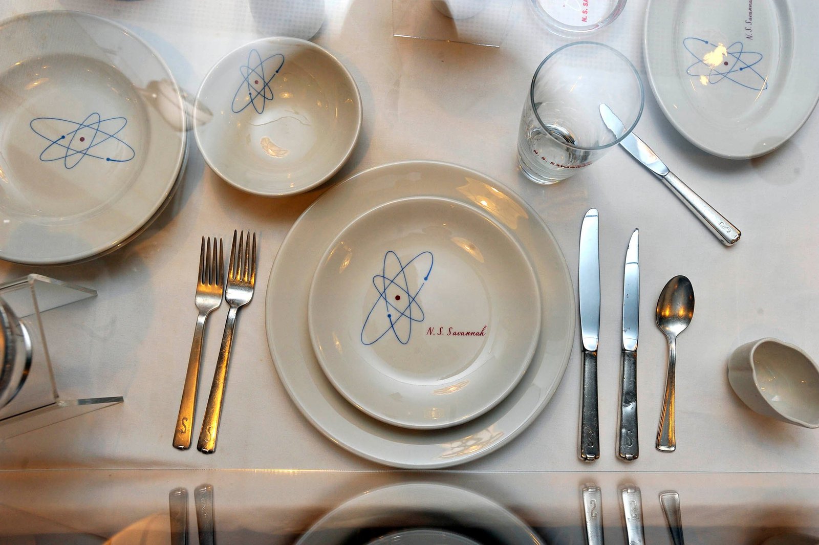 Plats and silverware with atom design.