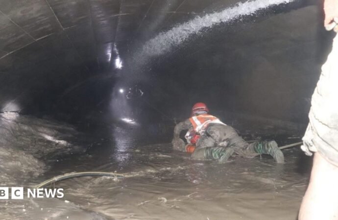 Nepal rescuers try to reach dozens trapped in tunnel after two pulled out alive
