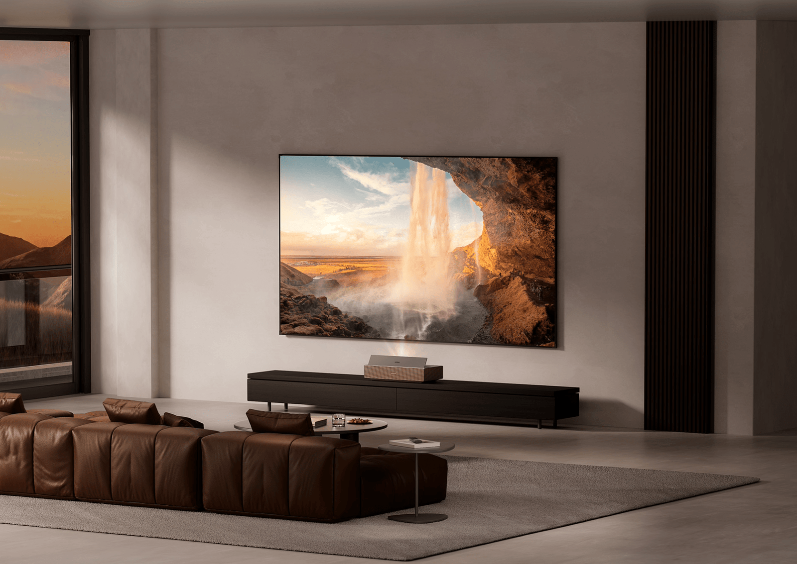 a sleek and modern living room with a flat TV on the wall. a video of a waterfall is on the TV