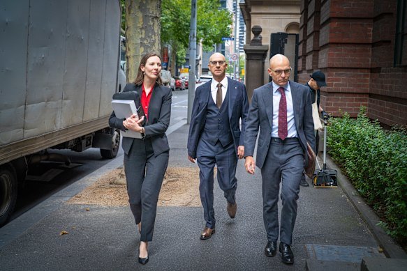 Alex Waislitz (centre) has welcomed a court outcome, settling a dispute about a Toorak townhouse. 