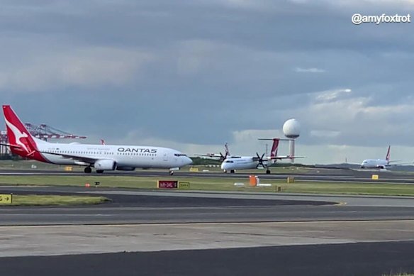 The Boeing 737 (left) and the Bombardier DHC-8 involved in a breakdown of co-ordination at Sydney Airport in July.