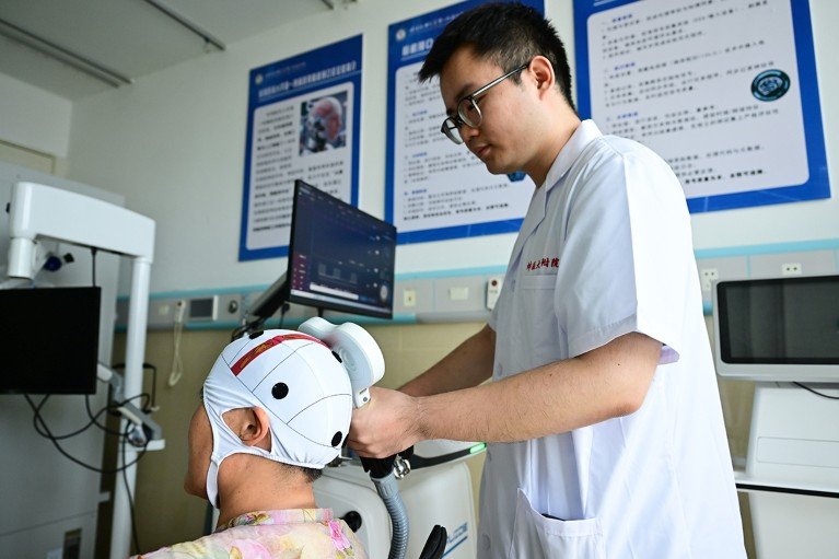 A medical worker provides rehabilitation therapy for a patient with a neuromodulation device at a hospital in Bengbu, China.