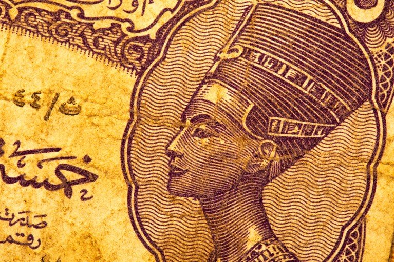 Close-up of old Egyptian bank note showing the depiction of Queen Nefertiti.
