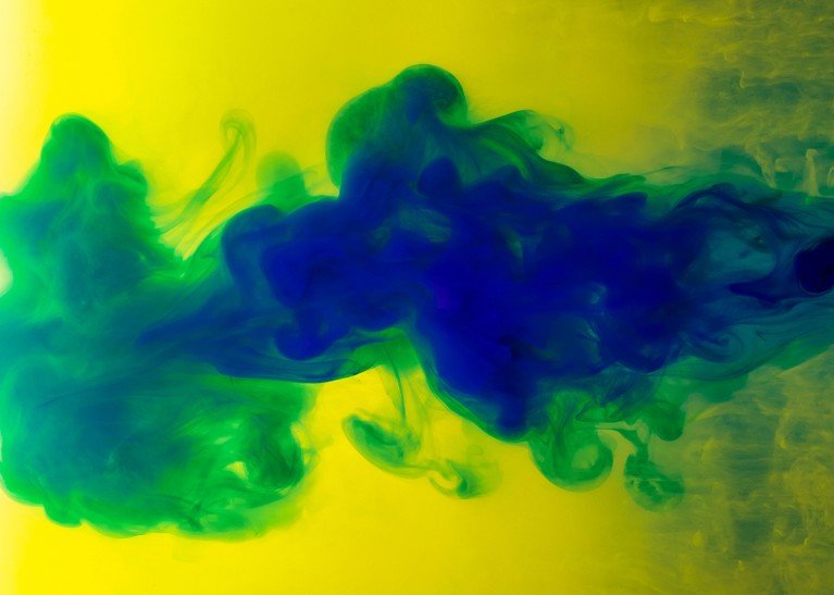 Abstract liquid background with dark liquid flowing into a lighter backdrop.
