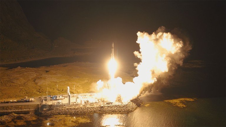 The Spectrum launcher lifts off at night from Andøya Spaceport in Norway in a huge plume of illuminated smoke.