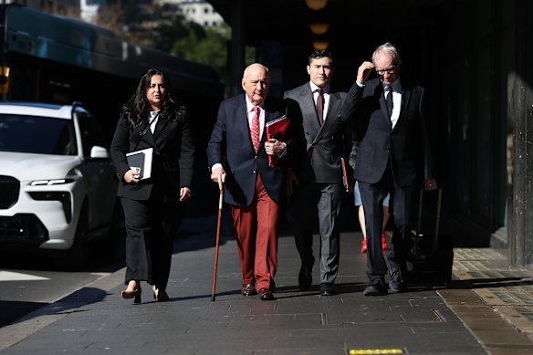 Alan Jones and his legal team outside the Downing Centre Local Court on Tuesday.