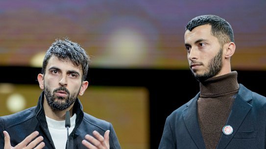 FILE - Palestinian Basel Adra, right, and Israeli Yuval Abraham receive the documentary award for “No Other Land” at the International Film Festival, Berlinale, in Berlin, Saturday, Feb. 24, 2024. (AP Photo/Markus Schreiber, File)