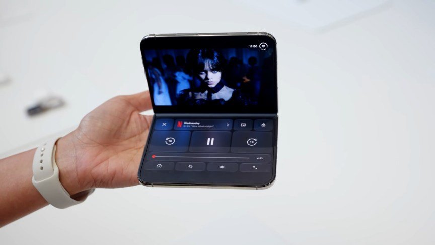 Netflix series Wednesday on the iPhone Duo, with controls on the bottom half of the inner display.
