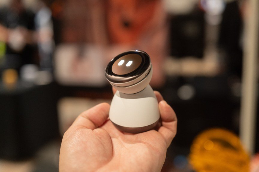Hand holding mini robot