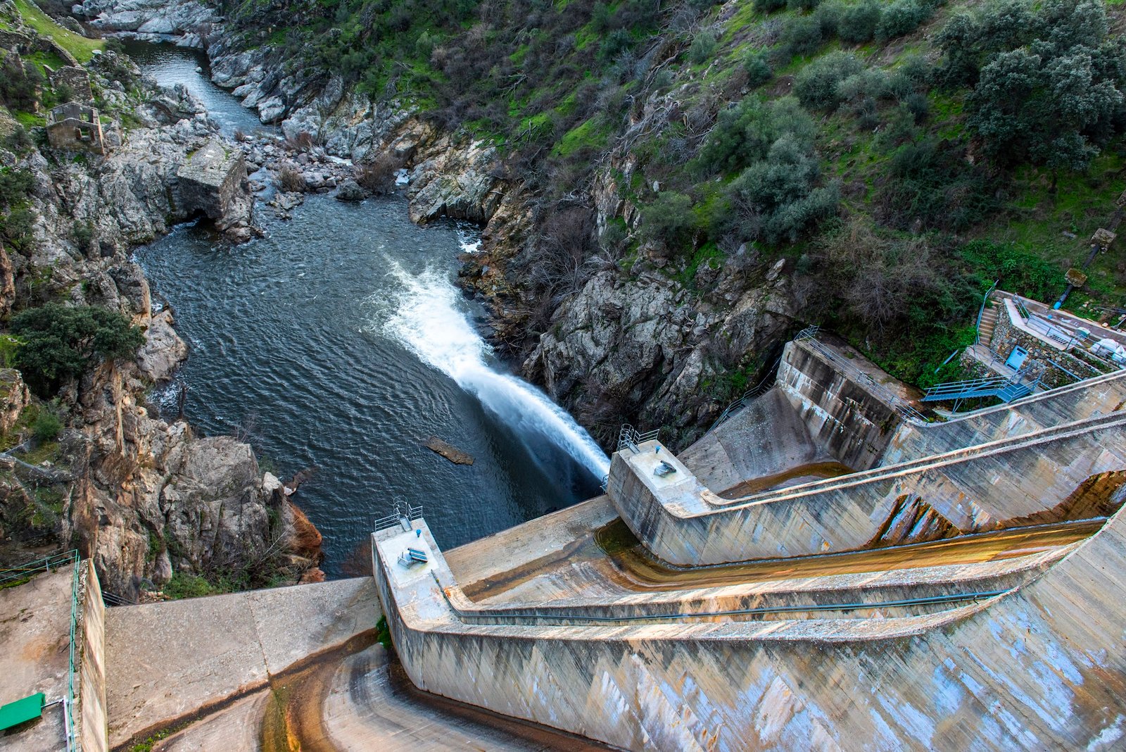 a photo of a dam in Spain seen spilling water.