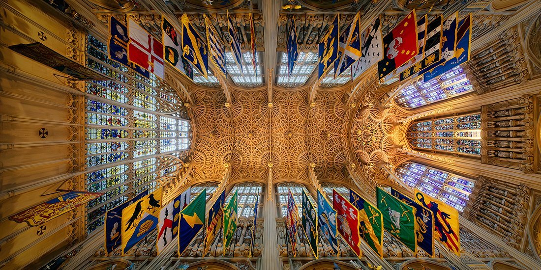 the ceiling and flags of ornate building interior