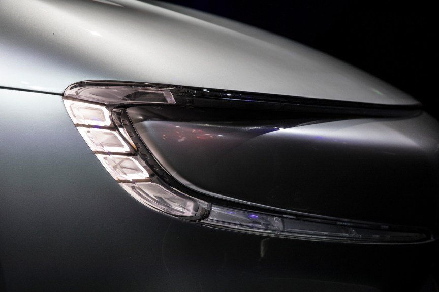 A close-up of a right headlight on a car.