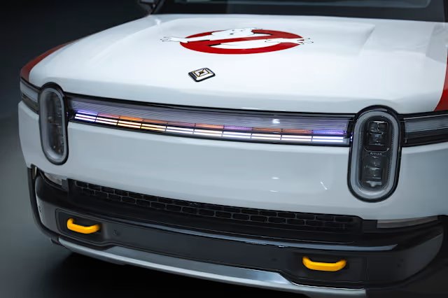 Rivian R1S front light bar illuminated in a multi-color display