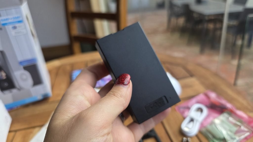 The battery is small enough to sit in my hand, and there are two in this package.