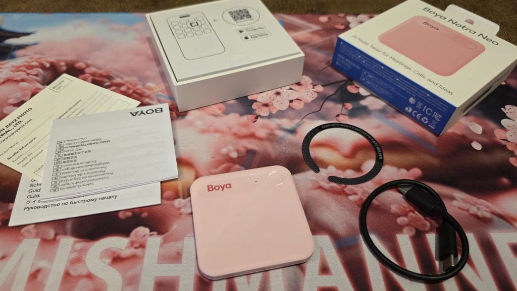 BOYA device, it's small, square, pink, with a pink on pink logo (the logo is darker pink), and the device is pale pink.