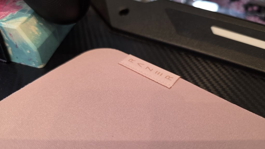 Close up of the Razer pink on pink stitching that's on the side of the mousemat.