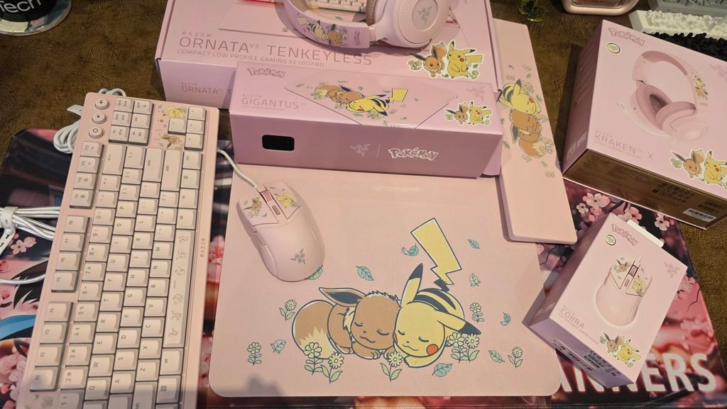 Top down shot of the full collection with the keyboard, mousemat, headset in the top just off the screen, and wristrest. The boxes are in the image too.