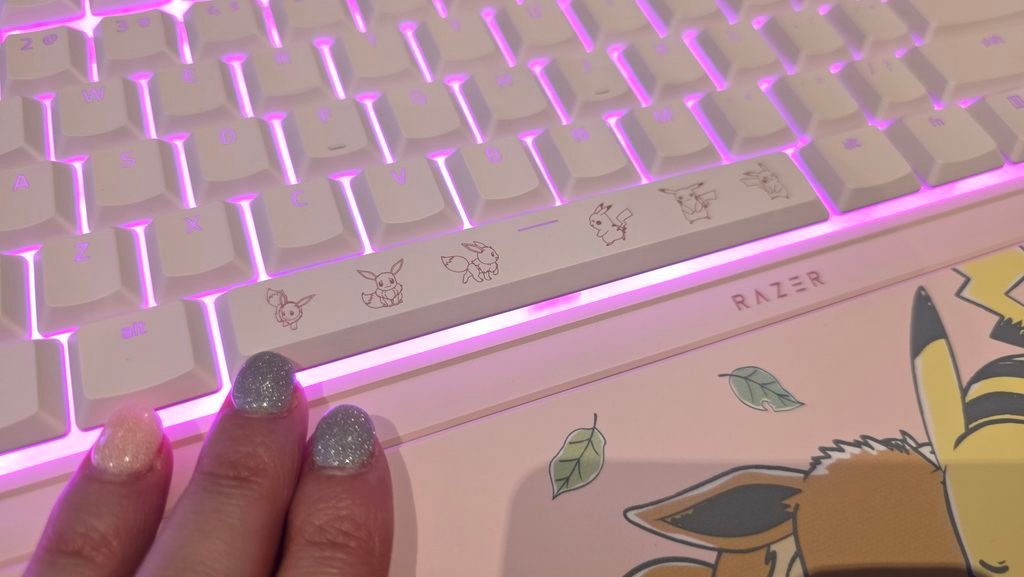 Close up of the spacebar showing the outlined Pink on Pink Pikachu and Eevee graphics.