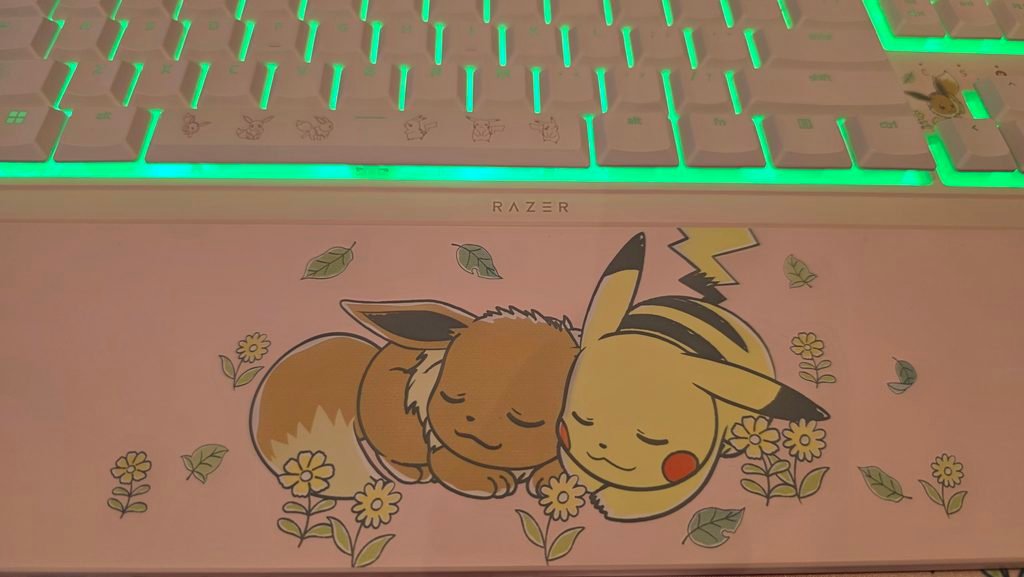 Close up of the wrist rest showing the sleeping Eevee and Pikachu.