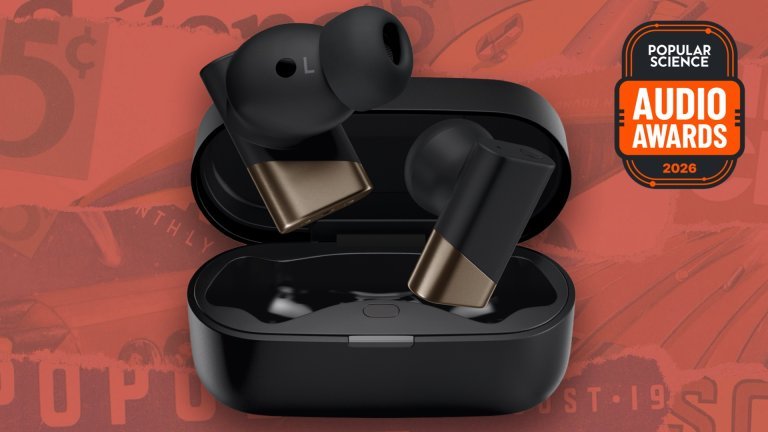 Status Audio GoldenSound Pro X earbuds in black and bronze in their open charging case