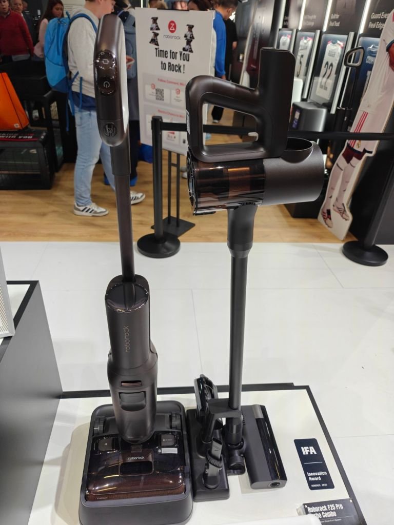 Roborock cordless and wet and dry vacuum and base station on display.