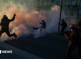 Clashes erupt between police and protesters in Paris