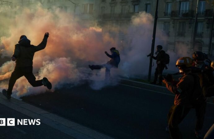 Clashes erupt between police and protesters in Paris