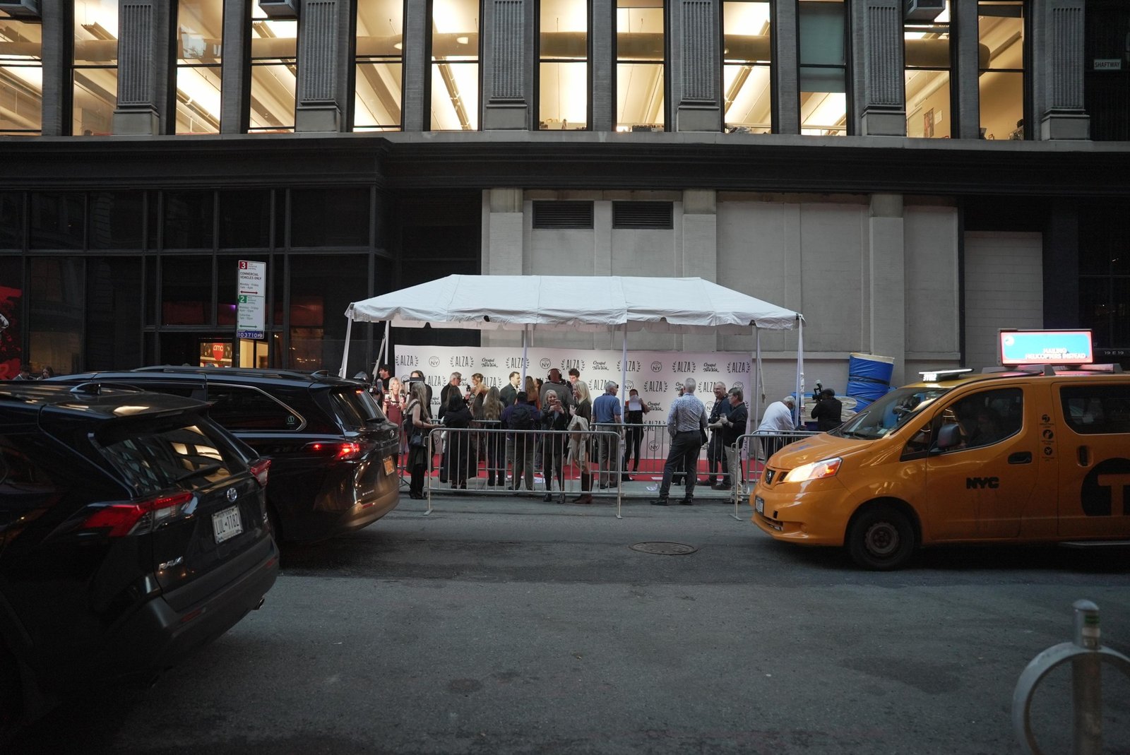 A photograph of a tented red carpet area next to a movie theater.