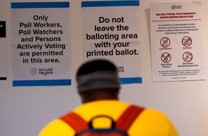 Democrats train tens of thousands of poll watchers as the Justice Department plans its largest-ever Election Day monitoring | Fortune