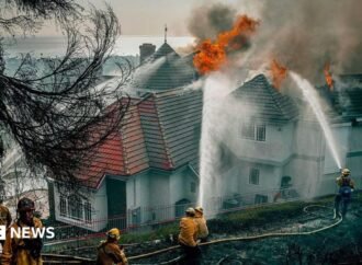 Fast-moving California wildfire burns homes as people are ordered to leave
