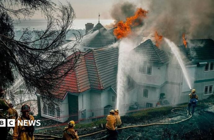 Fast-moving California wildfire burns homes as people are ordered to leave