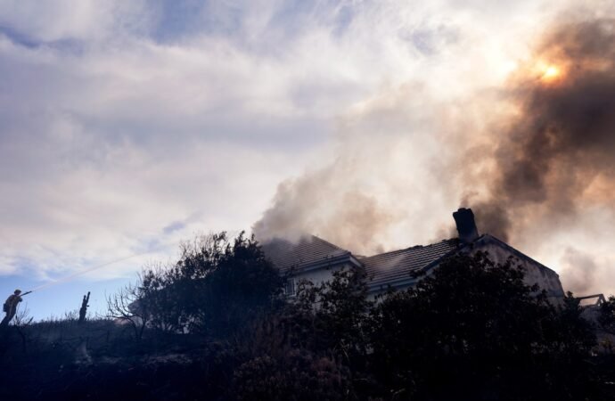 Fire crews battle Southern California blaze that burned 6 homes, led to the evacuation of 16,000