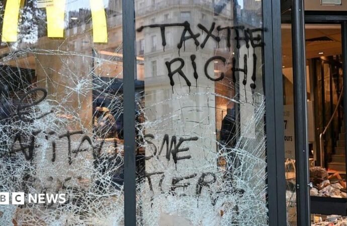 France protests: Burnt out cars and shattered glass on Paris streets after protests turn to riots and looting
