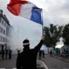 French police use tear gas and water cannons after some protests turn violent as shopkeepers board up storefronts across Paris | Fortune
