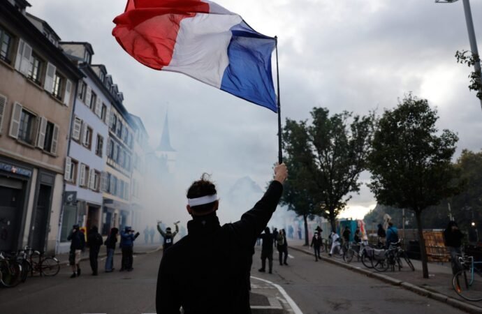 French police use tear gas and water cannons after some protests turn violent as shopkeepers board up storefronts across Paris | Fortune