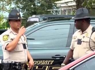 Georgia officials hunt for suspect in shooting that killed two and injured 35