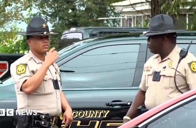 Georgia officials hunt for suspect in shooting that killed two and injured 35