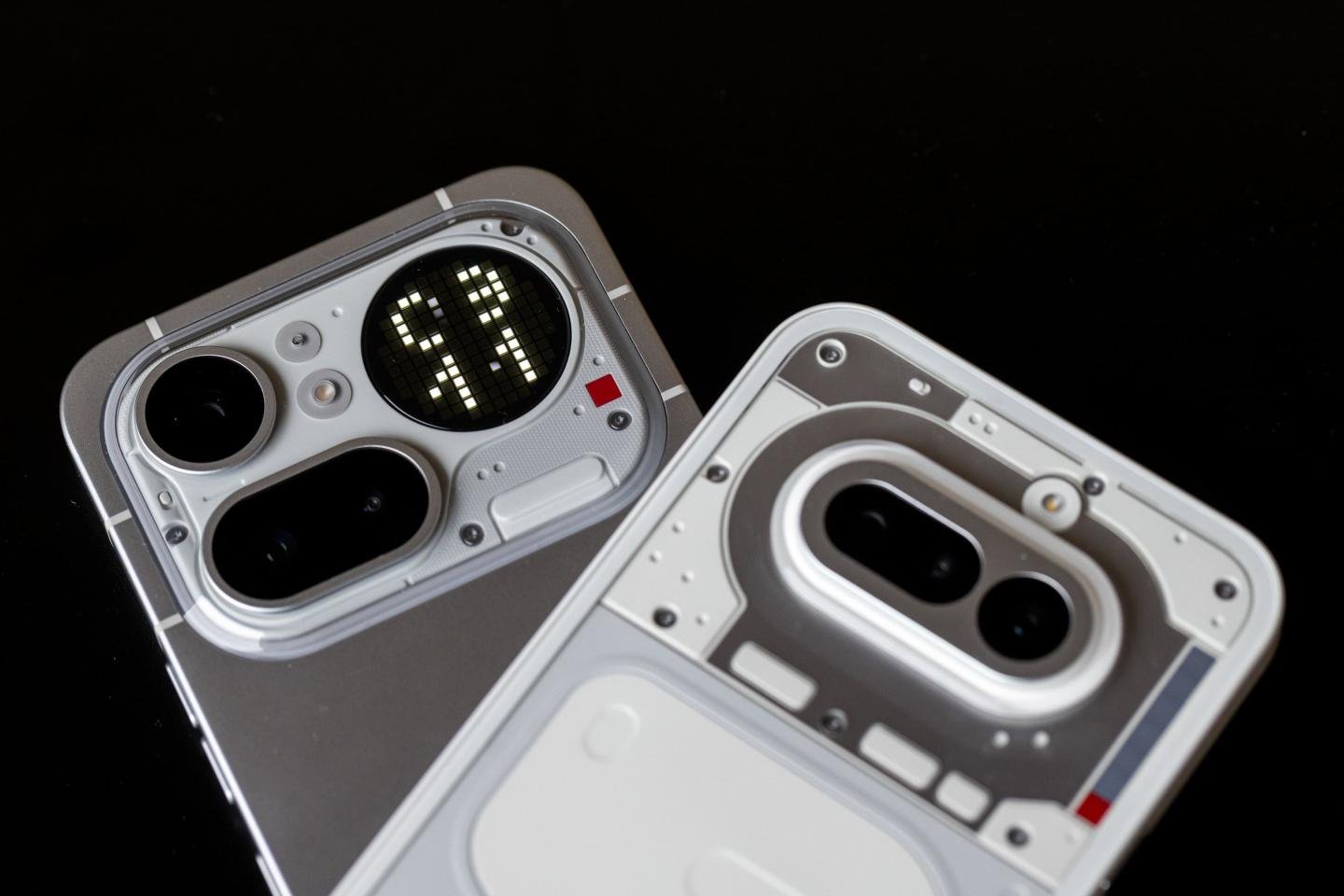 A Nothing Phone (4a) Pro, left, and a Nothing Phone (4a)