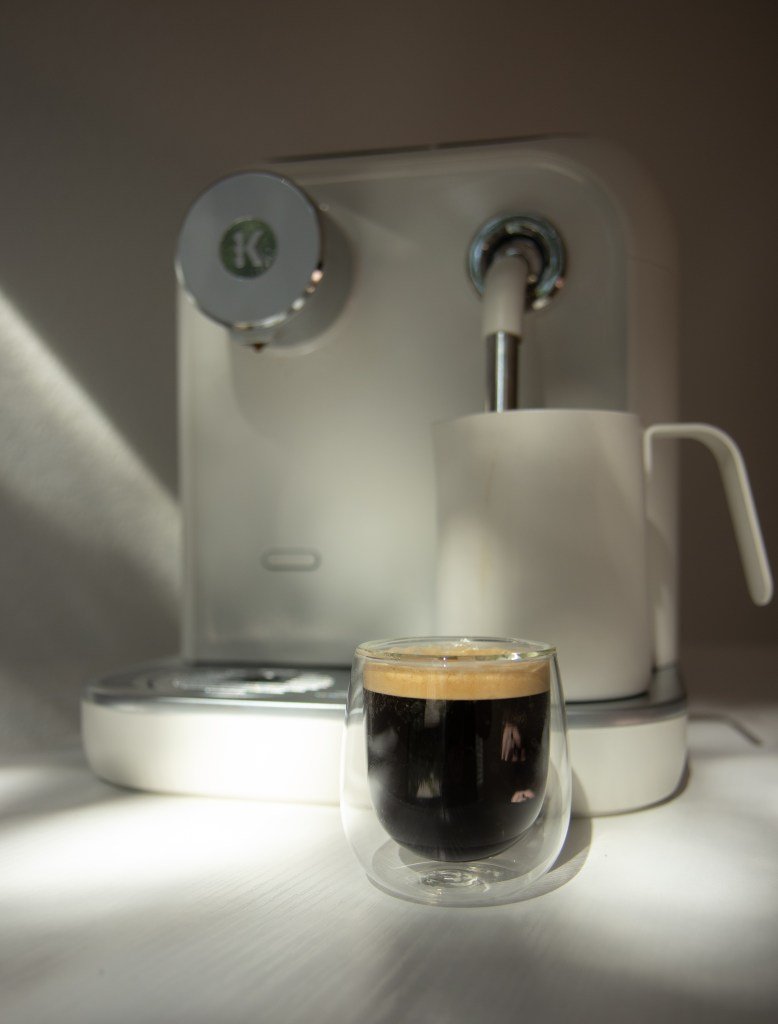 keurig alta with brewed cup of coffee in front