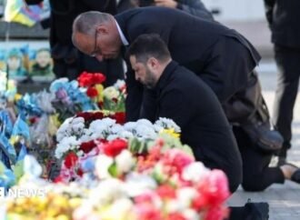 Kyiv bridge hit in further Russian drone attack as German chancellor makes surprise visit