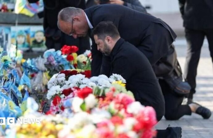 Kyiv bridge hit in further Russian drone attack as German chancellor makes surprise visit