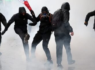 Storefronts close as police in Paris fire tear gas and water cannons on protesters