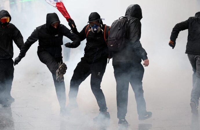 Storefronts close as police in Paris fire tear gas and water cannons on protesters