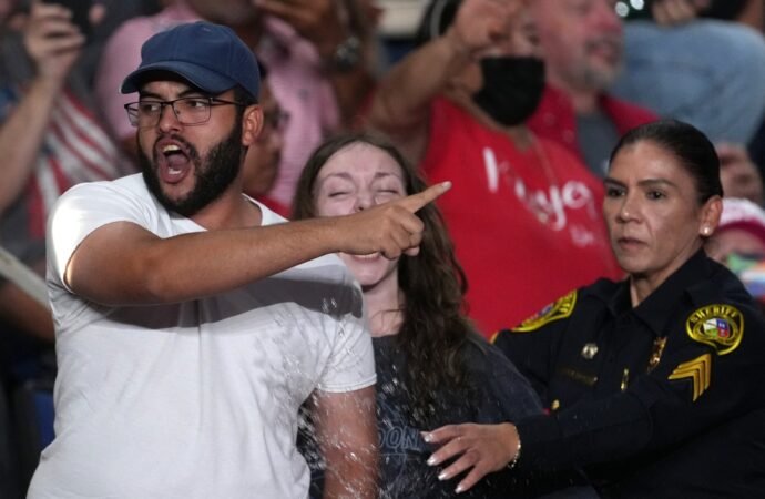 Trump interrupted by protesters as he fights to rally Texas voters behind Paxton in US Senate race