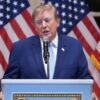 Trump puts new Russia sanctions passed by Congress on hold, saying waiver is in US national interest